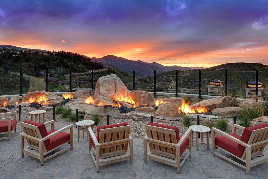 photo chairs around fire pit overlooking mountains